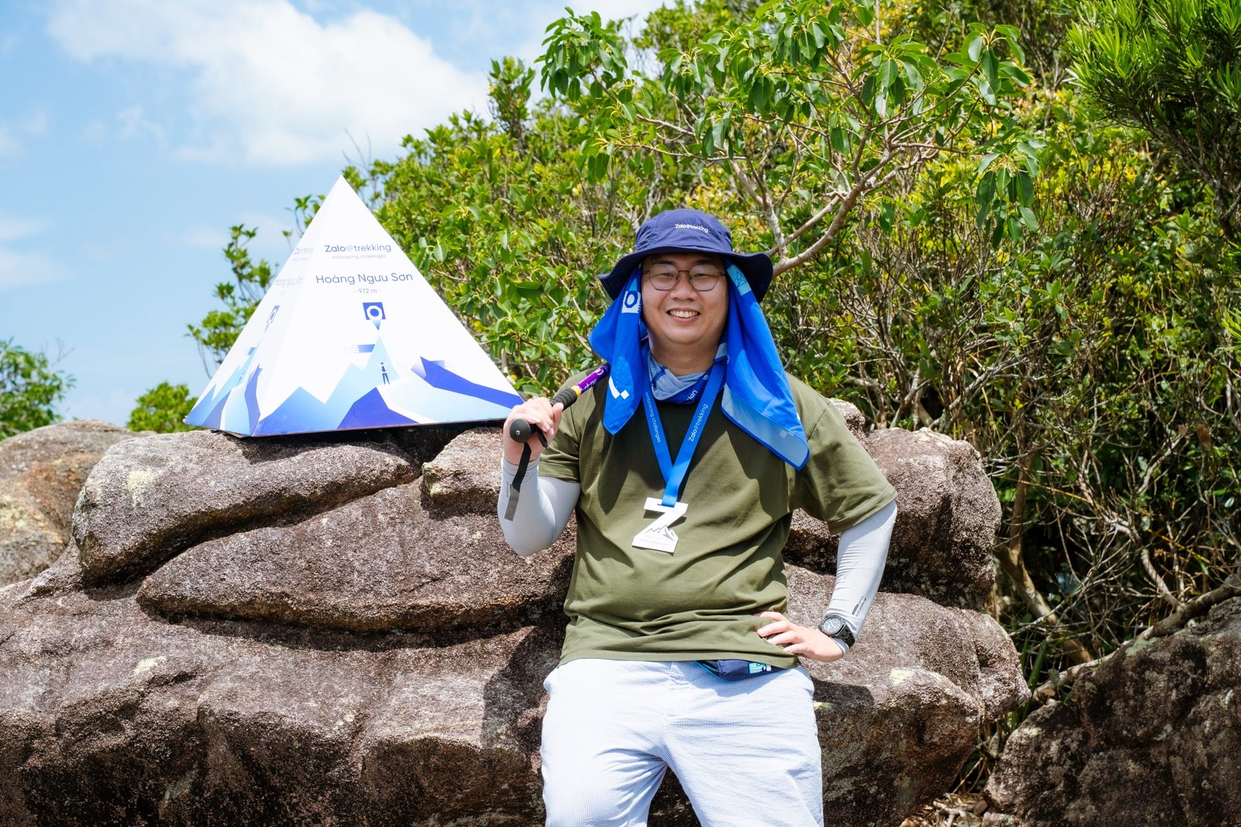 Nguyen Le Phong smiling on the trekking route near the Hoang Nguu Son marker