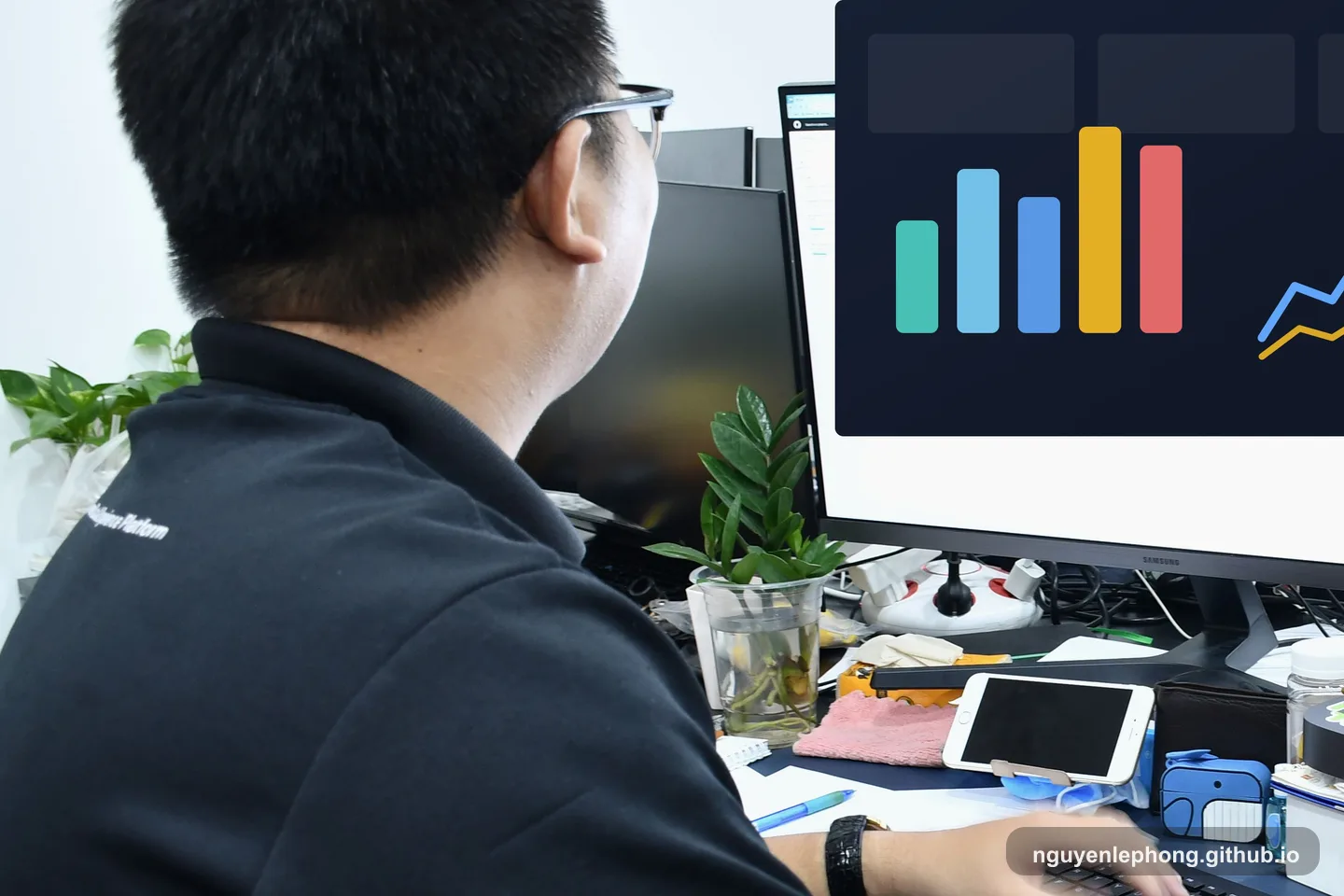 Nguyen Le Phong studies a simplified dashboard at his desk while narrowing a weekly scorecard to the signals worth watching.