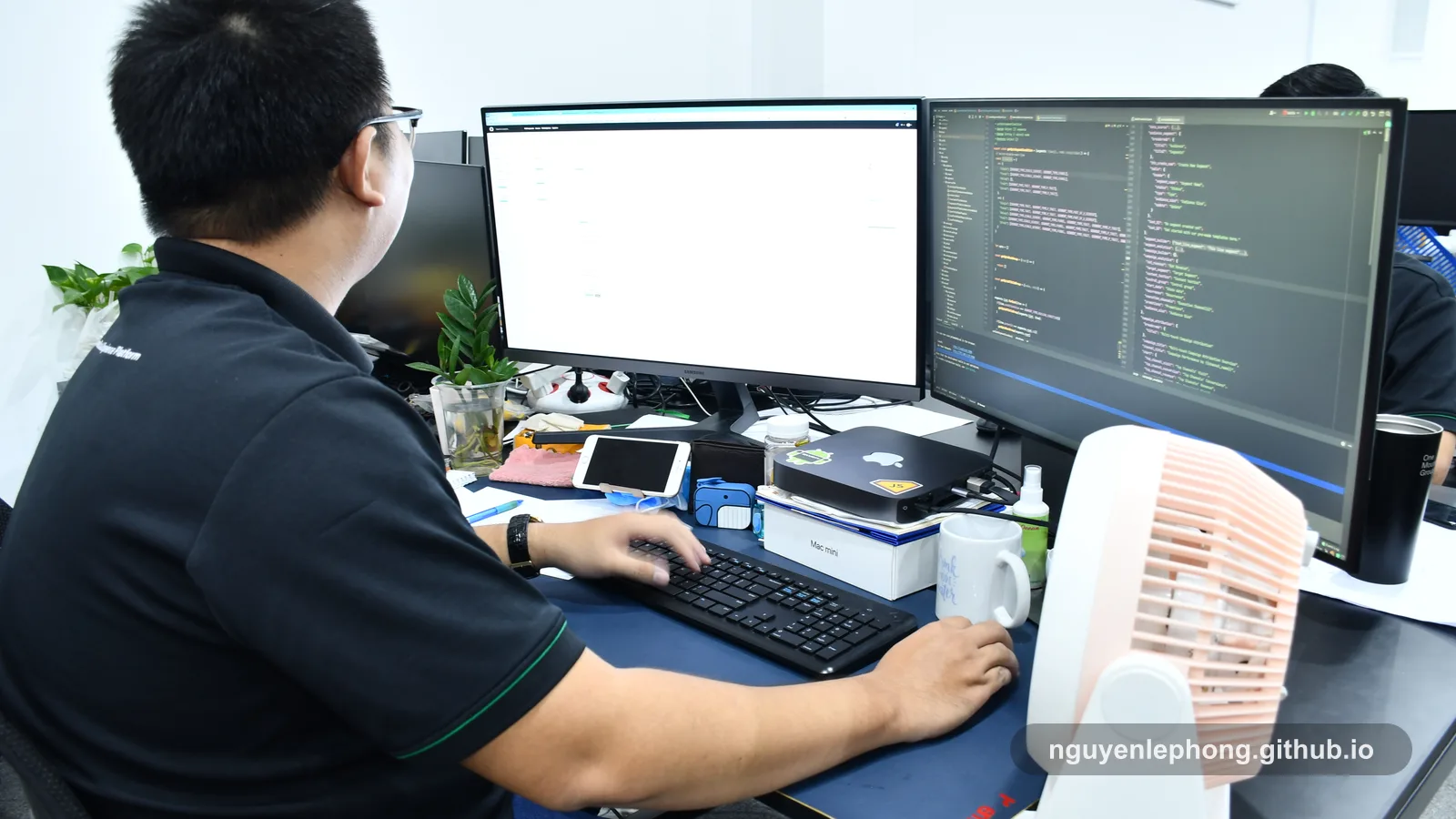 Nguyen Le Phong studies two development monitors at his desk, tracing how one user action is waiting on too many downstream services.