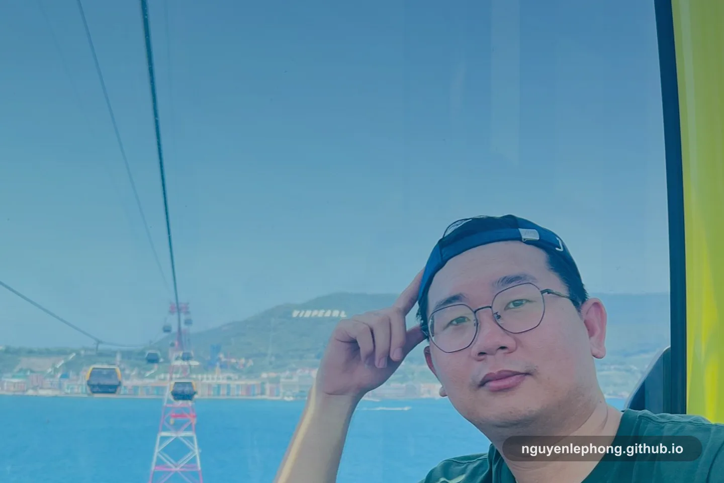 Nguyen Le Phong sits in a gondola above the coast during a daytime trip, evoking the kind of travel and daily planning that still needs small decisions.