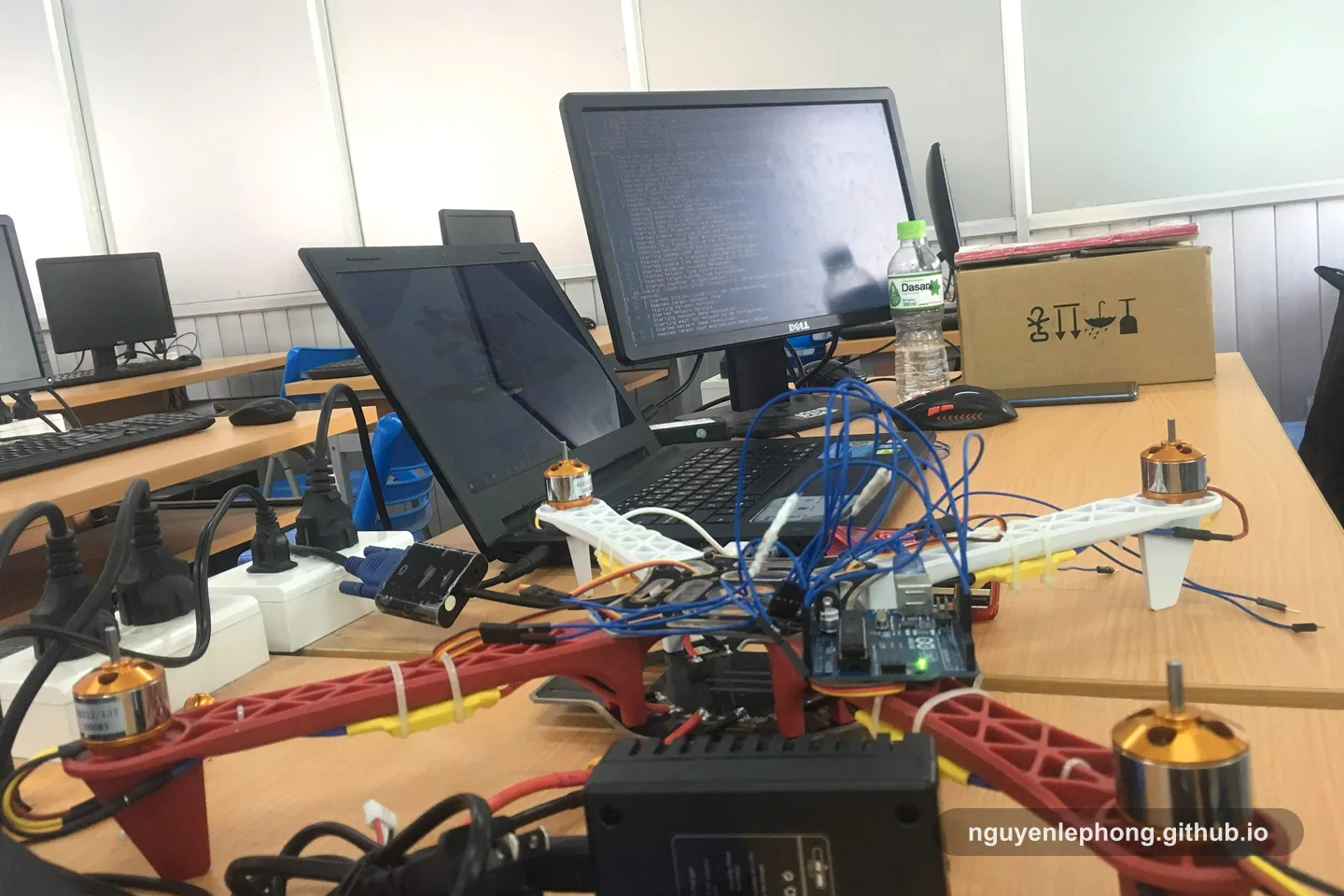 A prototype workbench with cables, sensors, and a laptop shows how signals become useful when they stay close to the system being tested.